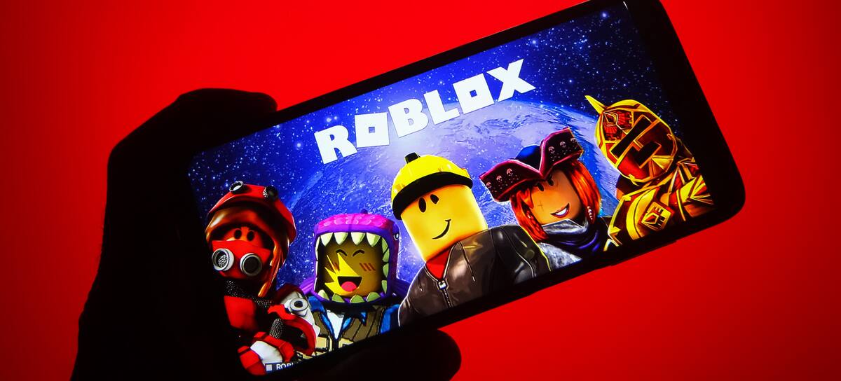 UKRAINE - 2021/10/05: In this photo illustration a Roblox logo of an online game platform is seen on a smartphone and a pc screen. (Photo Illustration by Pavlo Gonchar/SOPA Images/LightRocket via Getty Images)