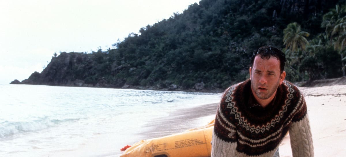 Tom Hanks washed up on the beach of an island in a scene from the film 'Cast Away', 2000. (Photo by 20th Century-Fox/Getty Images)