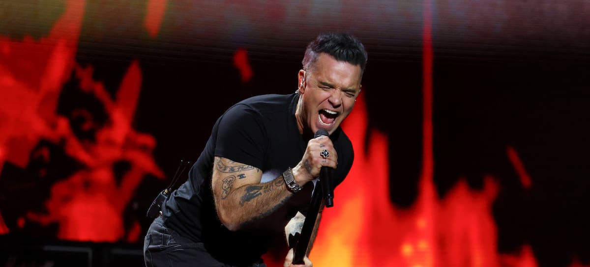 MANCHESTER, ENGLAND - FEBRUARY 28: (EDITORIAL USE ONLY) Robbie Williams performs on stage in tribute to Ozzy Osbourne during The BRIT Awards 2026 at Co-op Live on February 28, 2026 in Manchester, England. (Photo by JMEnternational/Getty Images)