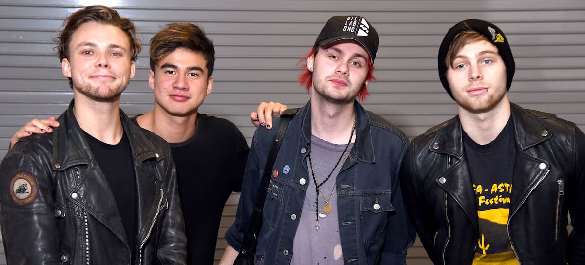 SAN JOSE, CA - DECEMBER 02: (L-R) Musicians Ashton Irwin, Calum Hood, Michael Clifford and Luke Hemmings of 5 Seconds of Summer pose backstage during the 6th Annual 99.7 NOW! Triple Ho Show at SAP Center on December 2, 2015 in San Jose, California. (Photo by C Flanigan/FilmMagic)