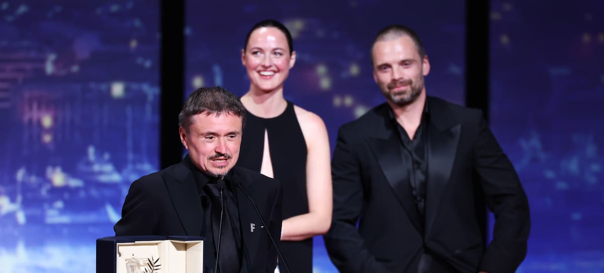 CANNES, FRANCE - MAY 23: Cristian Mungiu accepts the Palme d’Or for "Fjord" joined by Renate Reinsve and Sebastian Stan on stage during the closing ceremony of the 79th annual Cannes Film Festival at Palais des Festivals on May 23, 2026 in Cannes, France. (Photo by Andreas Rentz/Getty Images)