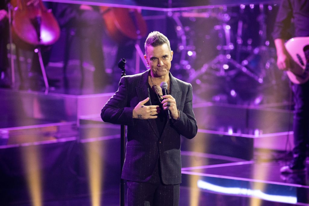 Robbie Williams dice que "ve mucho de si mismo" en Harry Styles
